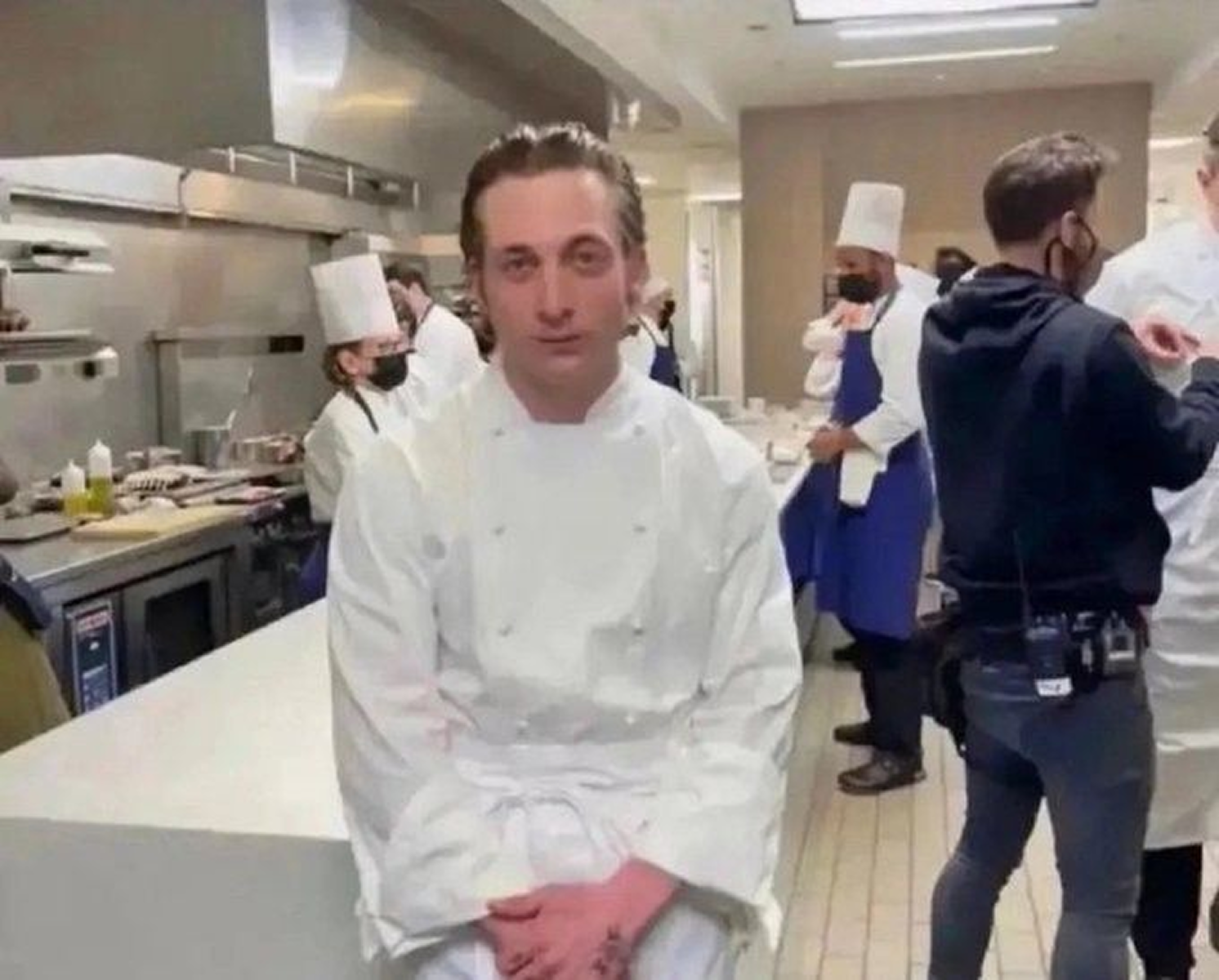 Chef in busy restaurant kitchen